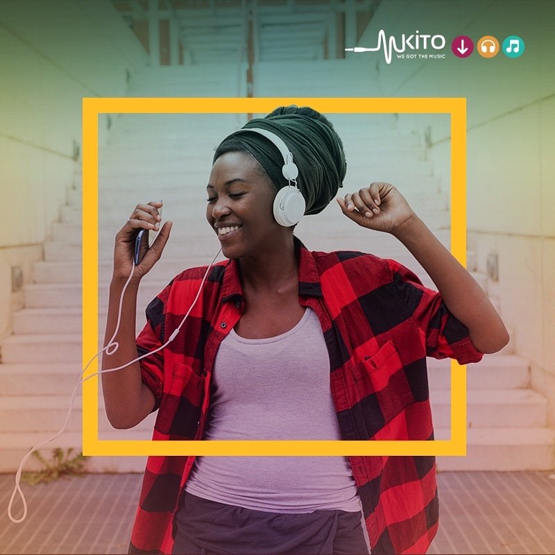 A lady using Mkito to stream African music